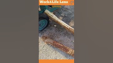 This machine pulls in logs and strips off the bark using a rotating circular blade.