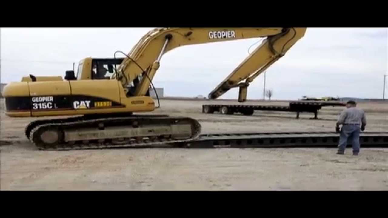 Loading an excavator on a double drop trailer YouTube