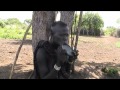 Mursi woman inserting lip plate