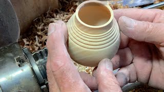 Richard Raffan turns a small pot from green elm.