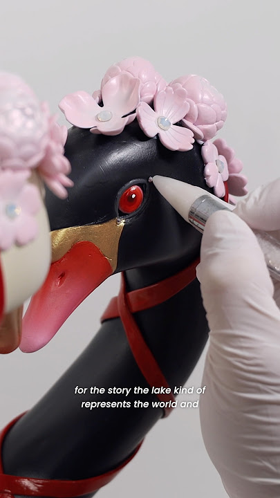 The twin swans are imagined as guardians of a lake