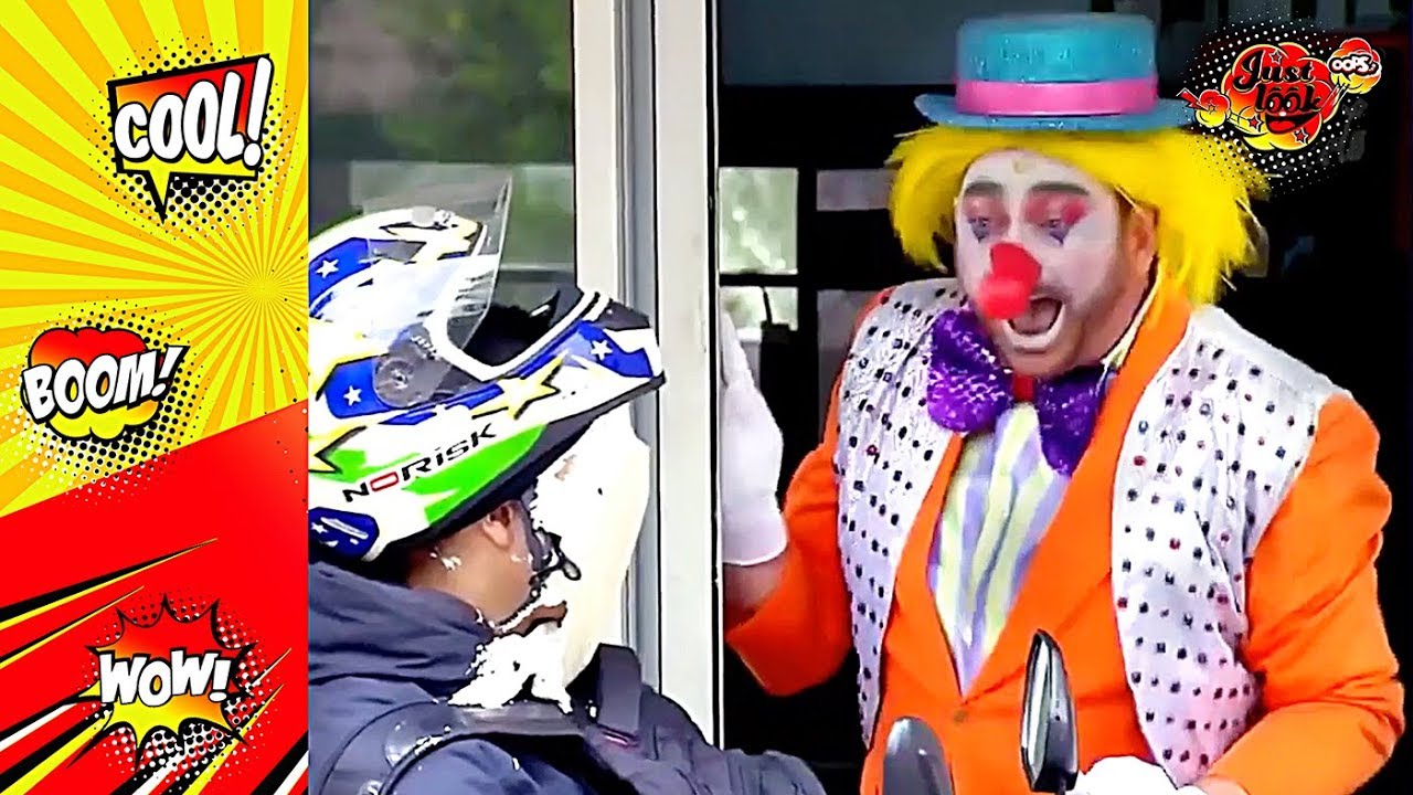 Clown Throwing Pie On Escalator