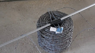 Barbed Wire Carrier Tool, tool to help carry a roll of wire
