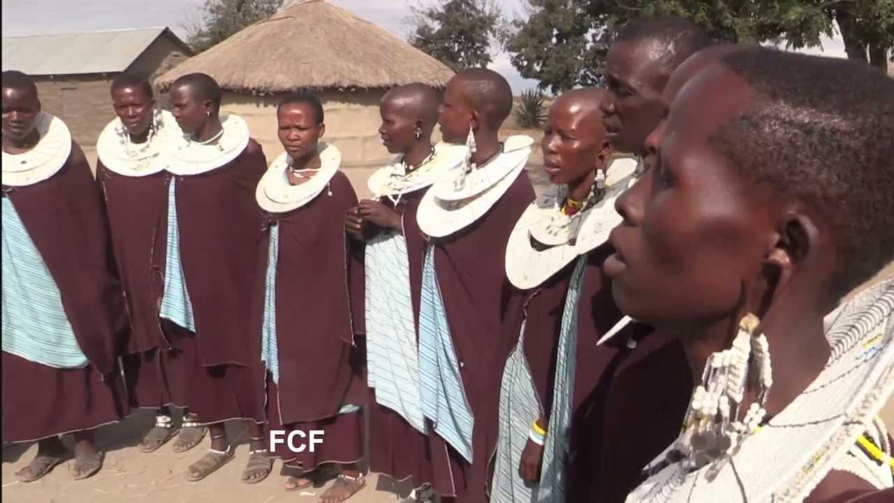 A Tanzanian Maasai tribe's singing and jumping dance in their boma