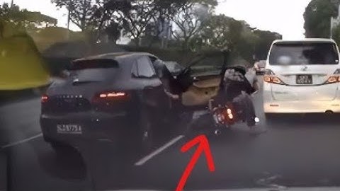 Porsche hits two motorcycles while changing lanes - Singapore