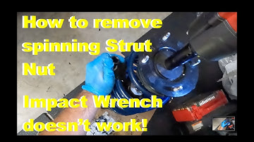 How to remove strut spinning nut. Impact wrench doesn