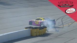 Leader Larson spins while trying to get on pit road