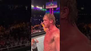 Logan Paul Filming Himself While Jumping On Roman Reigns Through Announcment Table