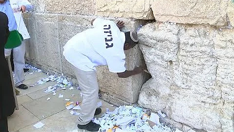 Watch: Thousands of prayer notes removed from Western Wall
