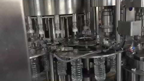 plastic bottle washing filling capping and semi automatic shrink sleeve labeling video