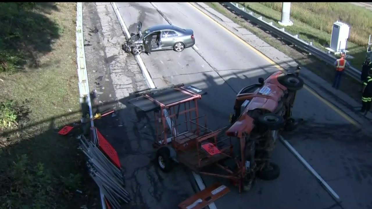 Two road workers injured when vehicle strikes truck on M-5 near Drake Road