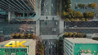 4K Drone Footage Shows square street traffic bird eye view day light 06