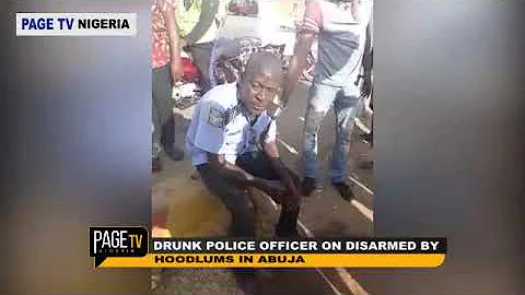 Drunk Nigerian Police Officer Disarmed by Hoodlums in Abuja