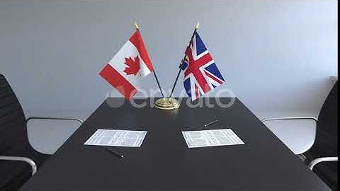 Flags of Canada and Great Britain and Papers on the Table | Motion Graphics - Envato elements
