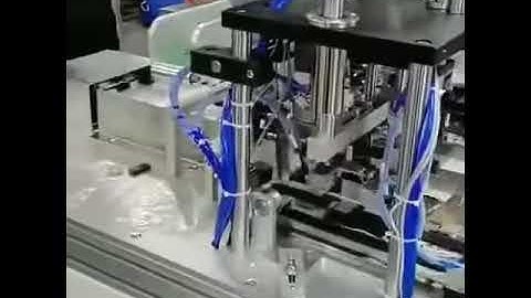 Automatic mask machine with an earloop welding table