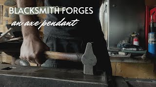 Off grid Blacksmith forges an axe pendant / fire steel.