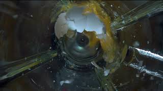 Egg in a blender in slow motion