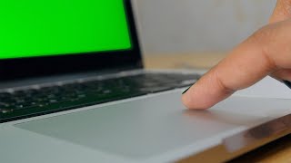 A girl moving her pointing cursor of a laptop's touchpad