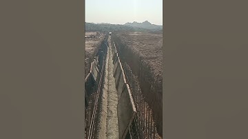 fixing of reinforcement completed and formwork inprogress for strom water rcc drain along road