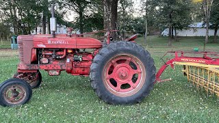 Farmall Super M-TA raking hay
