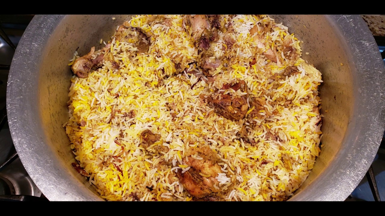 Hyderabadi Chicken Dum Biryani on stove top by Spicy Kitchen