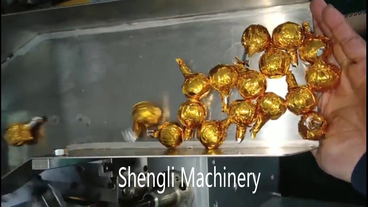 Sesame balls side twist packing machine - YouTube