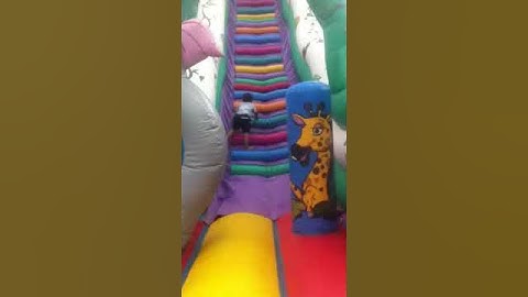 Nico at funfair on bouncy castle