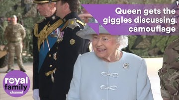 Queen gets the giggles discussing camouflage with troops