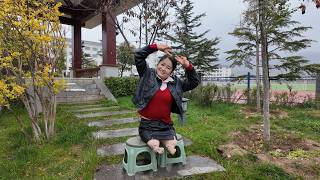 Tina, An Amputee Girl, Strolls In The Park In The Rain.