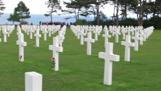 Taps at flag lowering, American cemetery, Omaha Beach, Normandy