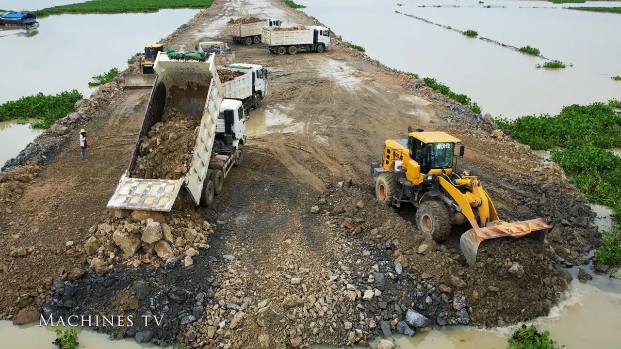wow-super-wheel-loader-pushing-stone-build-new-road-over-big-lake