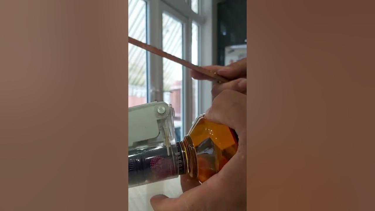 How to remove alcohol bottle security tag YouTube