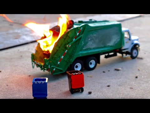 GARBAGE TRUCK bursts into flames - first gear