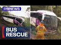Passengers rescued after bus slips down embankment | 9 News Australia