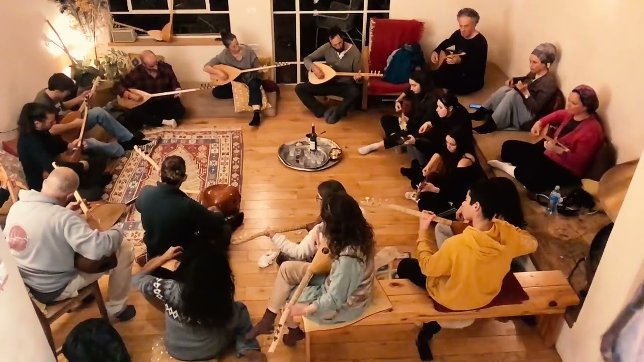 Students of all ages play saz baglama in Barak's course