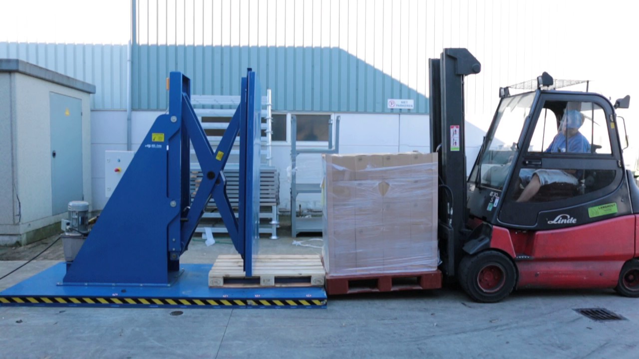 Stationary Pallet Changer - Transferring goods from pallet - YouTube