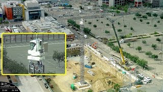 A tower crane rises in San Diego - Time-lapse, variable speed with some closeups