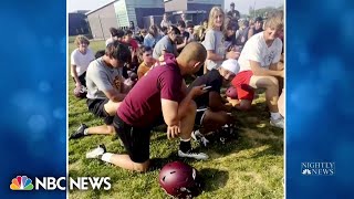 High school football player celebrates with team after learning he’s cancer free