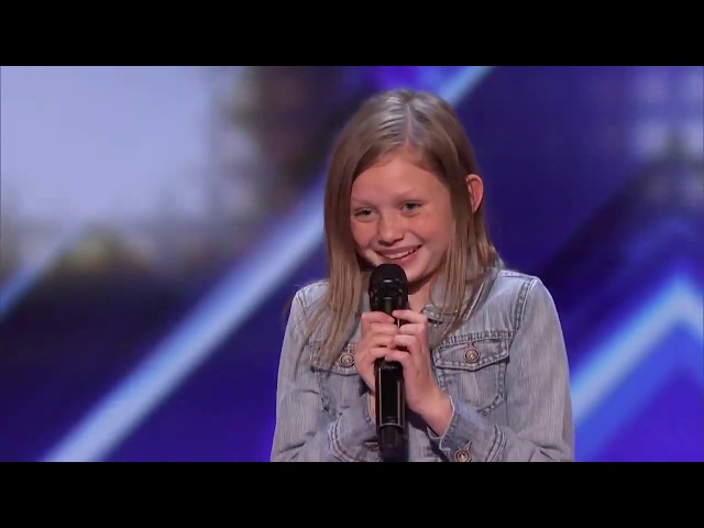 This 12-Year Old Didn't Back Down When Simon Cowell Asked Her to Sing Again Without Music AGT class=