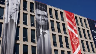 More banners on buildings and Trump has statues placed in the Rose Garden.