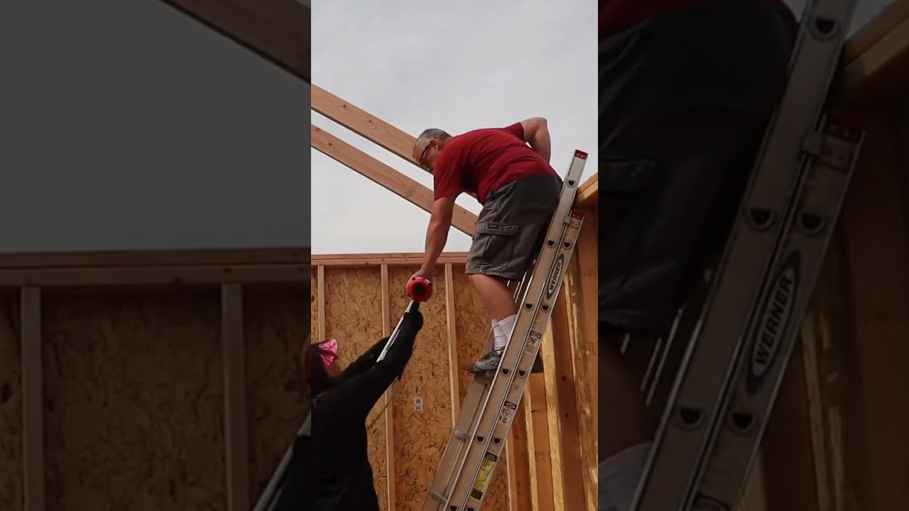 Couple Installing 12X16 DIY Shed Roof Rafters 