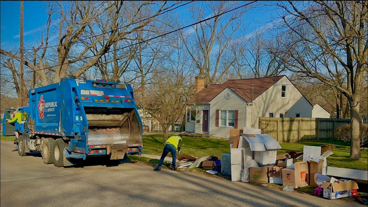 Republic Services Heil Rear Loader Garbage Truck Packing a Bulk Trash