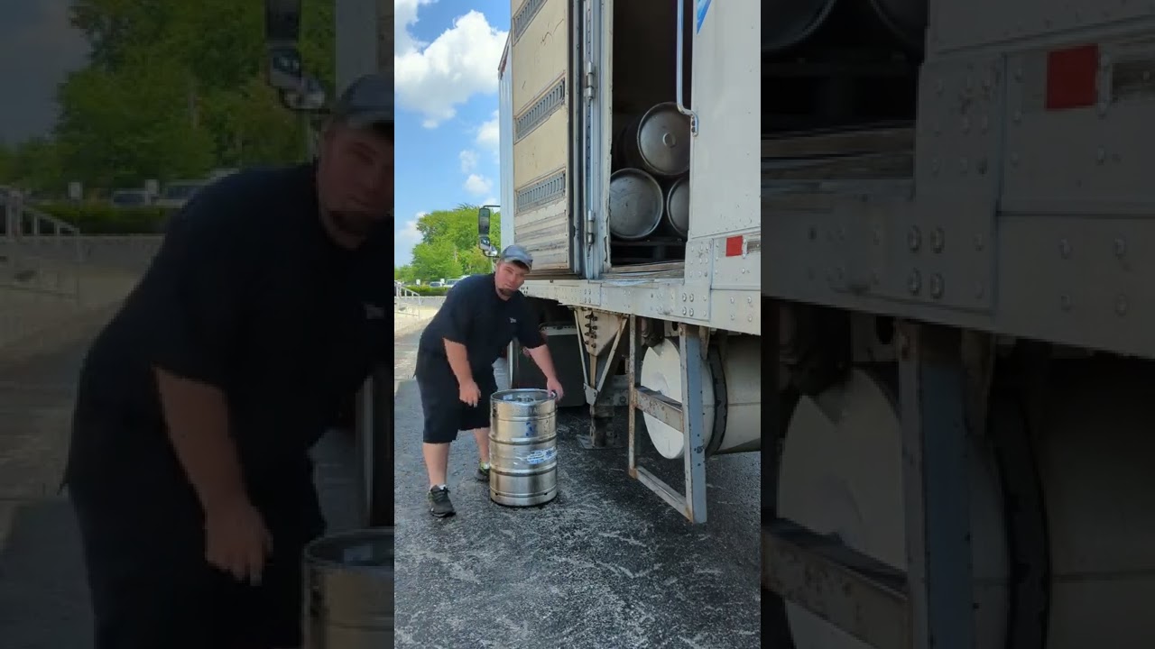beer driver throws keg back on truck