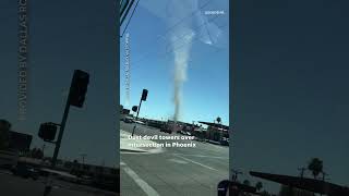 Dust devil towers over Phoenix intersection