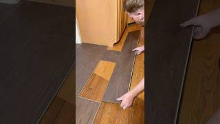 How to cut and install LVP flooring under kitchen cabinets #hardwood #laminate