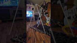 Little boy spins around on baby jumper and gets real dizzy then falls over and bumps head