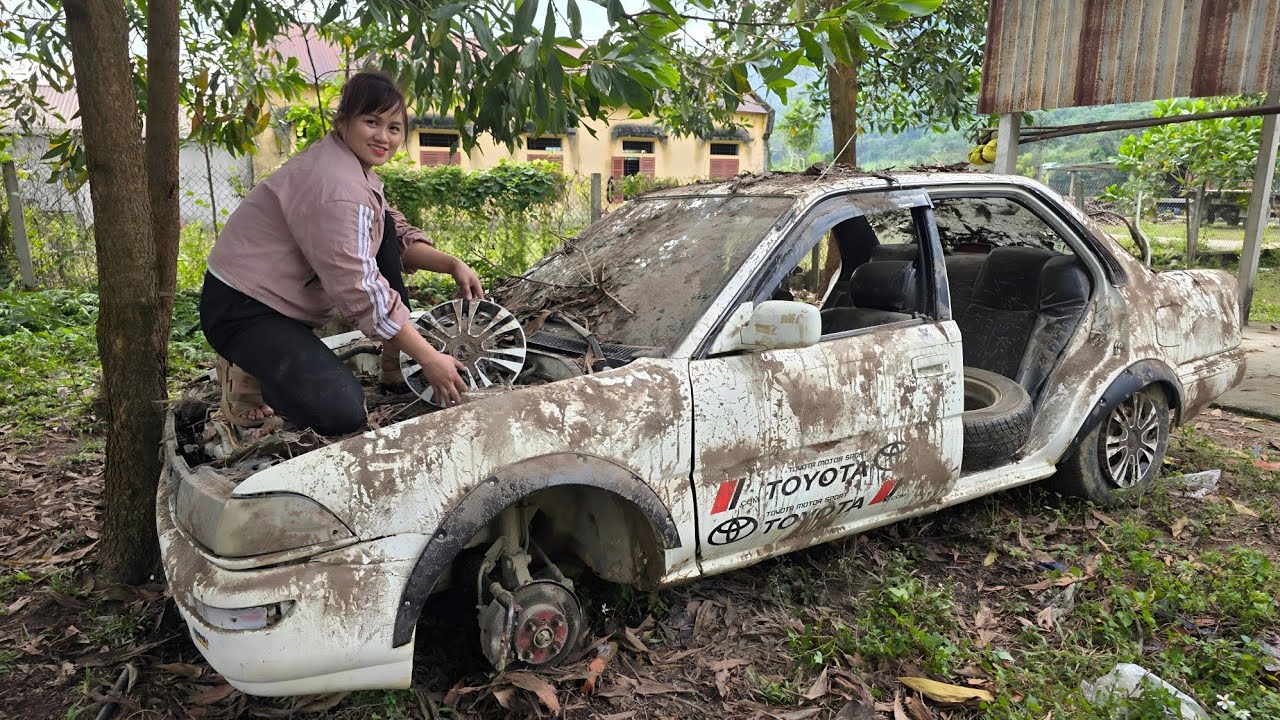 Girl repairs and restores old cars with broken engines that don't work.