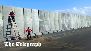 Egypt builds large cement wall at Gaza border, for aid 'logistics zone' officials say