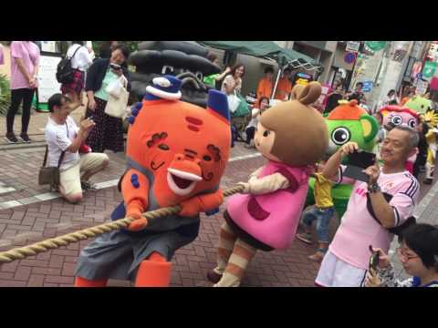 Japanese Mascots In A Tug Of War