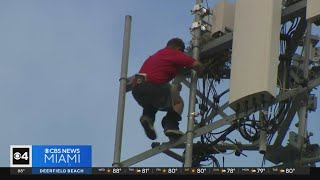 Man taken into custody after climbing a Miami cell tower